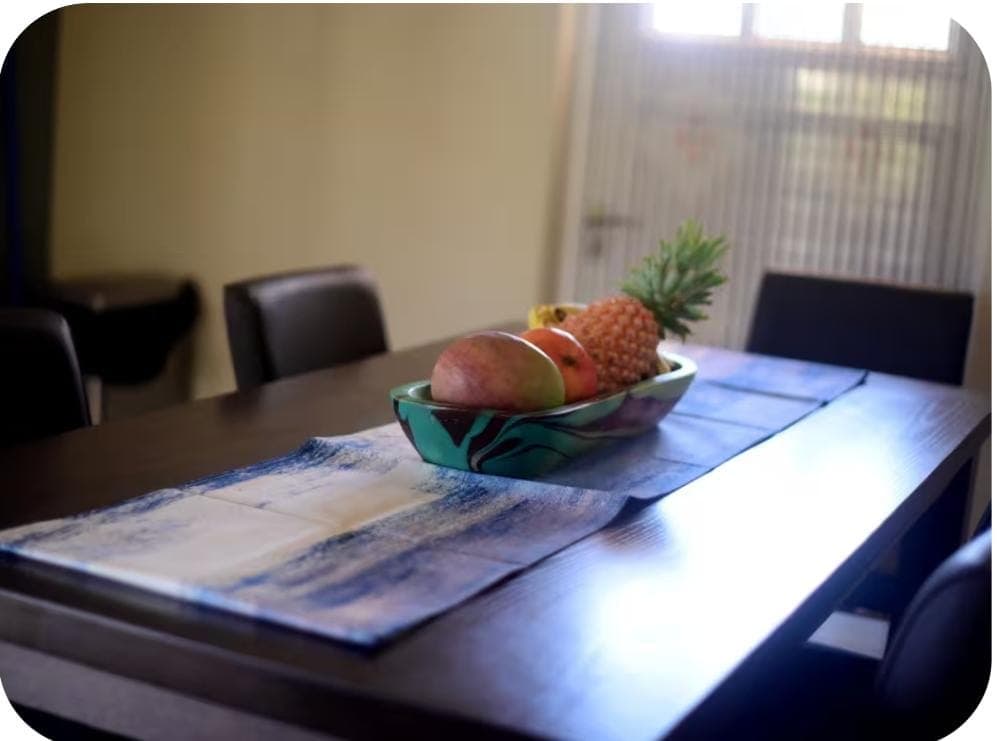 Dining table with fresh tropical fruit centerpiece